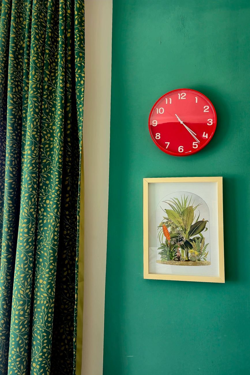 Framed botanical wall art displayed in a warm, curated home interior